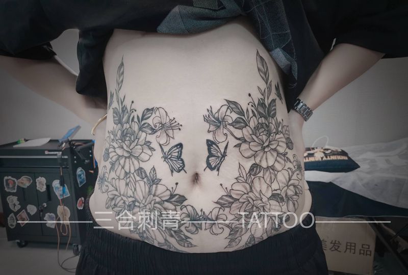 妊辰纹遮盖纹身图片_腹部纹身图案