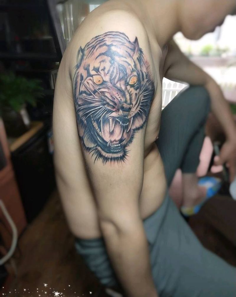 如虎得翼纹身图片_手臂纹身图案