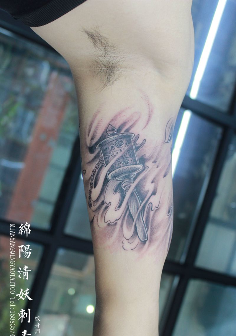 转经轮纹身图片_手臂纹身图案