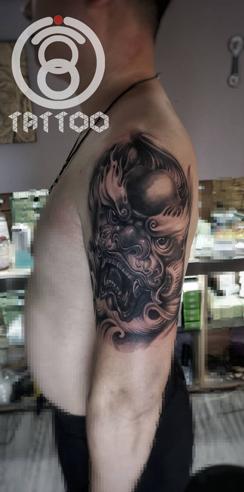 遮盖唐狮一枚纹身图片_手臂欧美写实纹身图案