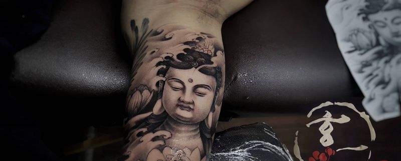手臂内测佛头纹身图片_手臂新传统纹身图案