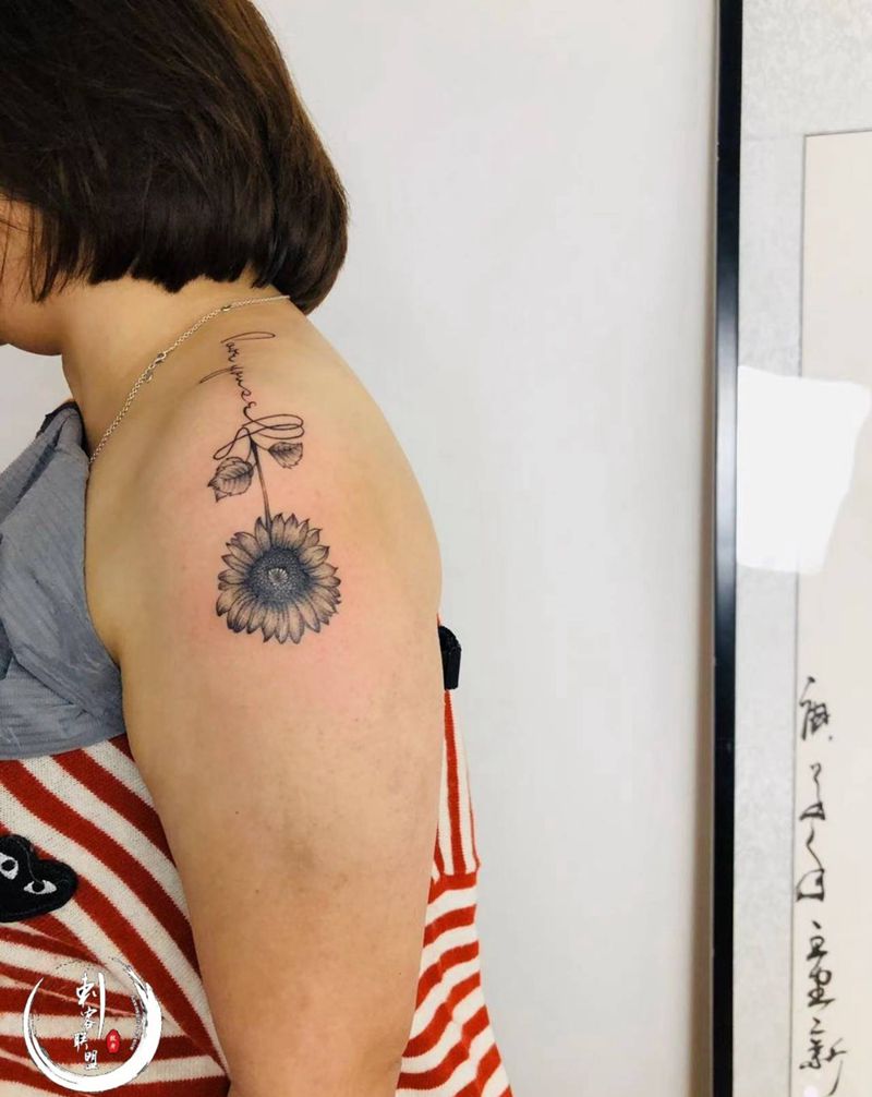 太阳花纹身图片_手臂花纹身图案