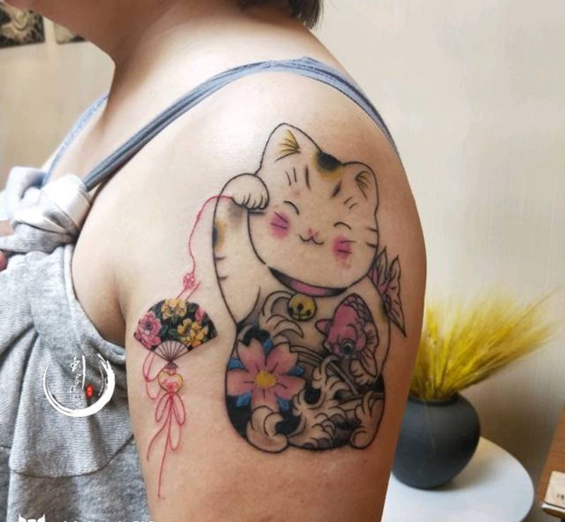 招福猫纹身图片_手臂欧美写实猫纹身图案