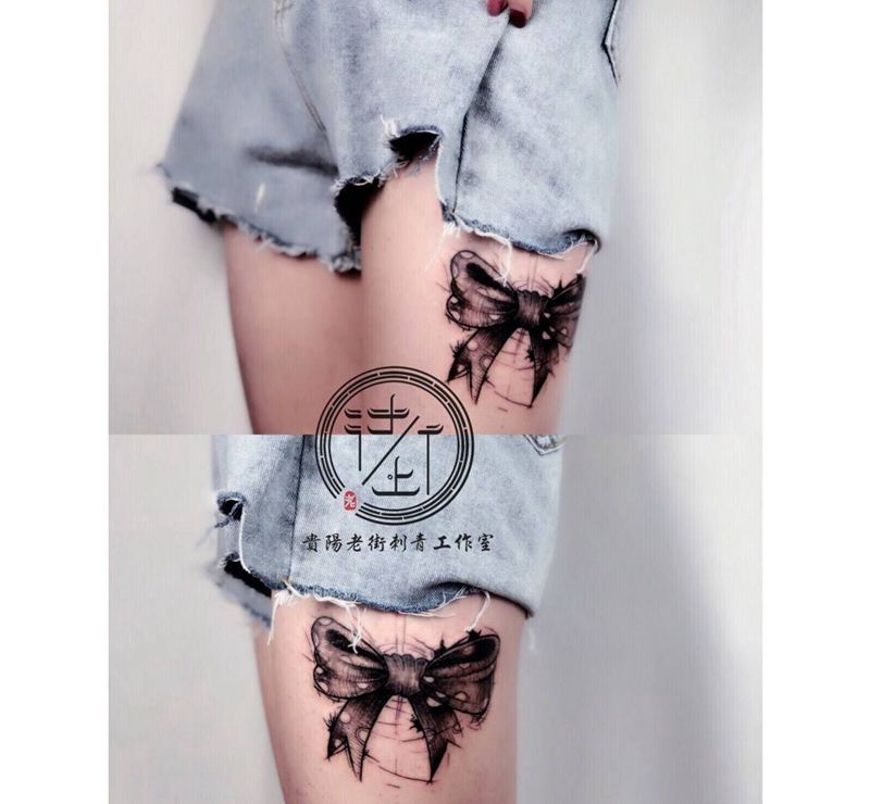蝴蝶结纹身图片_腿部点刺蝴蝶结纹身图案