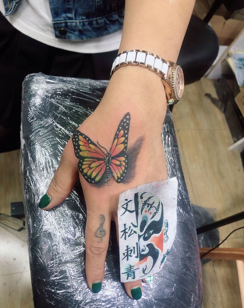 蝴蝶遮盖纹身图片_手臂纹身图案
