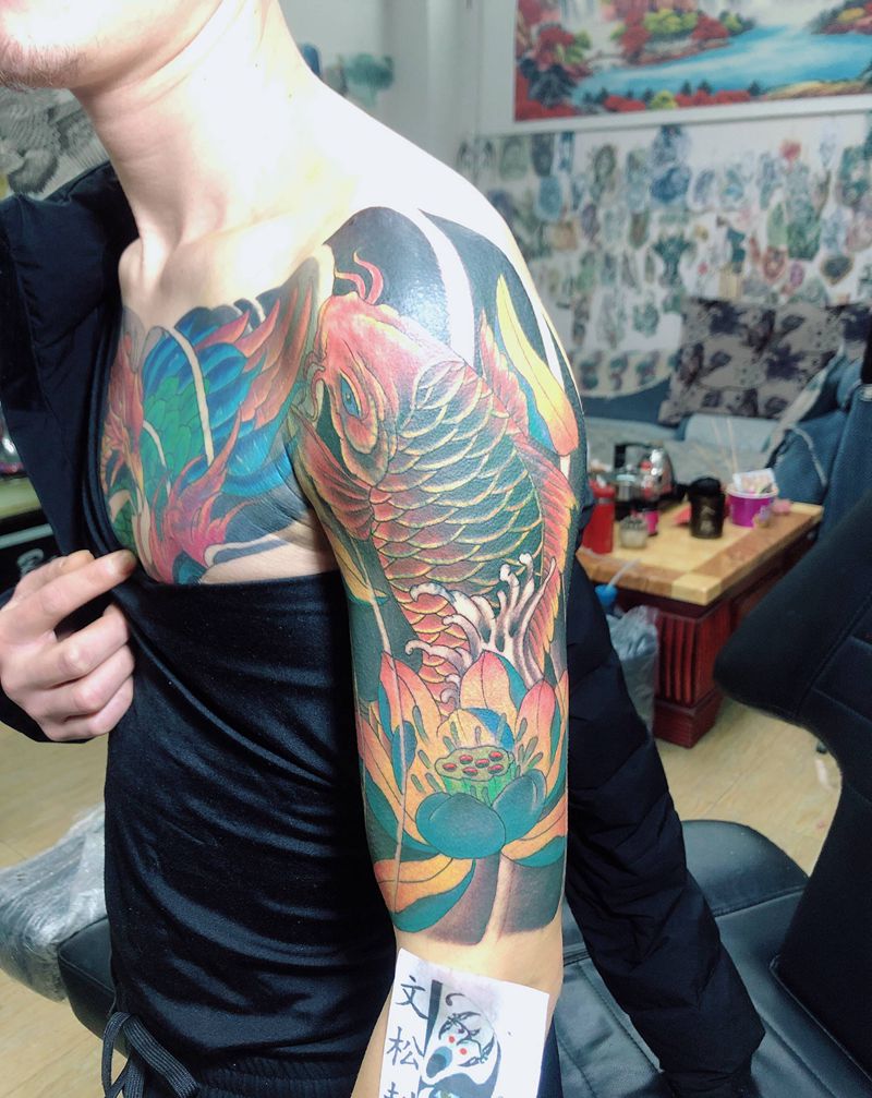 鱼遮盖纹身图片_手臂纹身图案