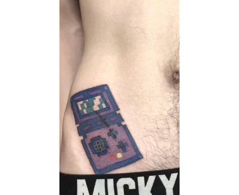 游戏机纹身图片_腹部纹身图案