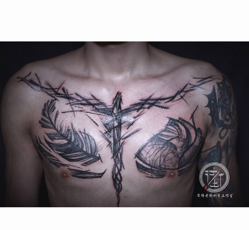 花胸纹身图片_胸部点刺几何花胸纹身图案