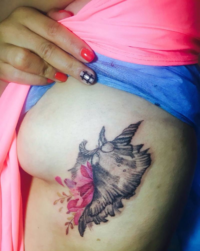 胸下海螺纹身图片