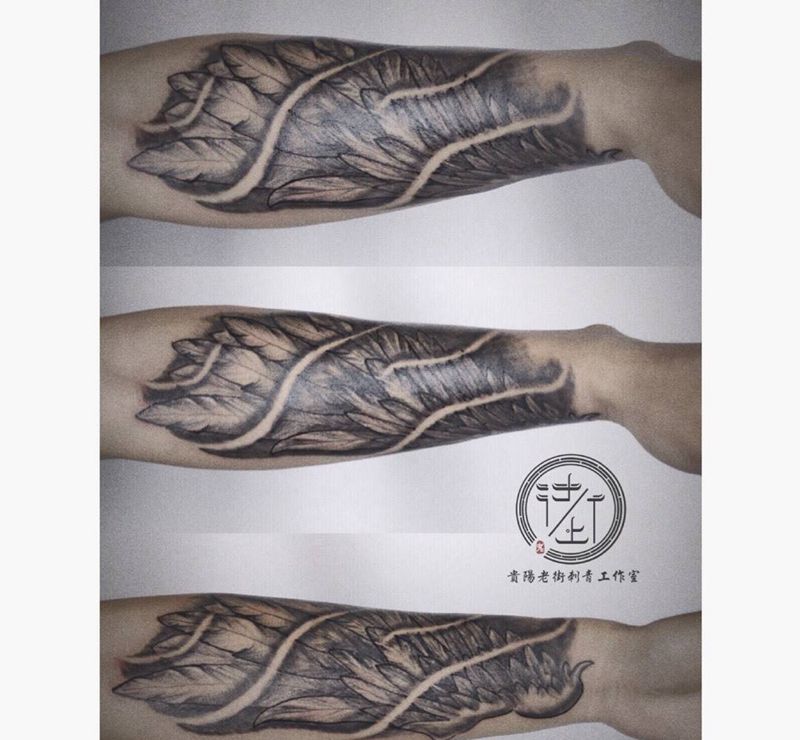 翅膀纹身纹身图片_欧美原创手臂写实贵阳成品纹身图案