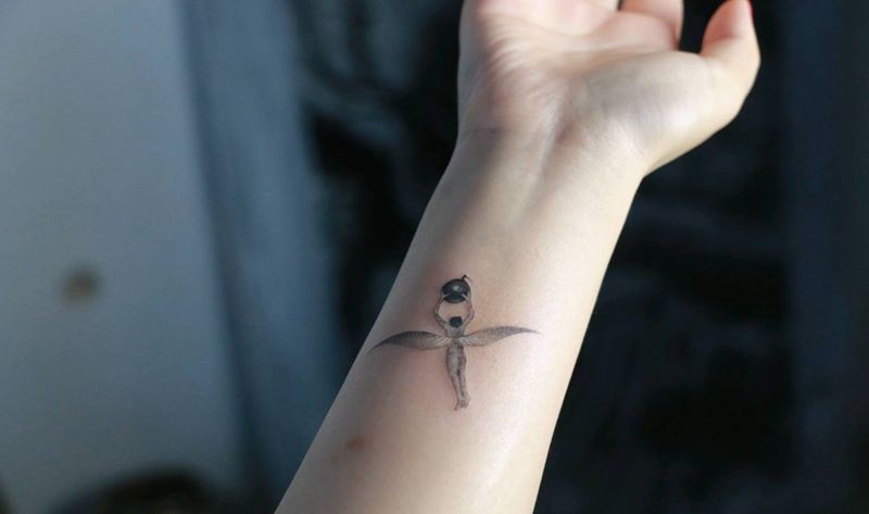 人间乐园纹身图片_手臂欧美写实纹身图案