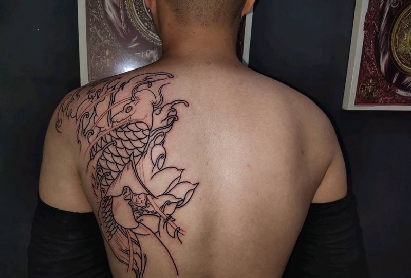 鲤鱼未完下次继续纹身图片_手臂新传统纹身图案