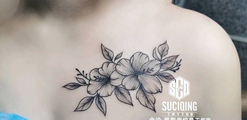 山茶花纹身图片_胸部手臂新传统欧美写实纹身图案