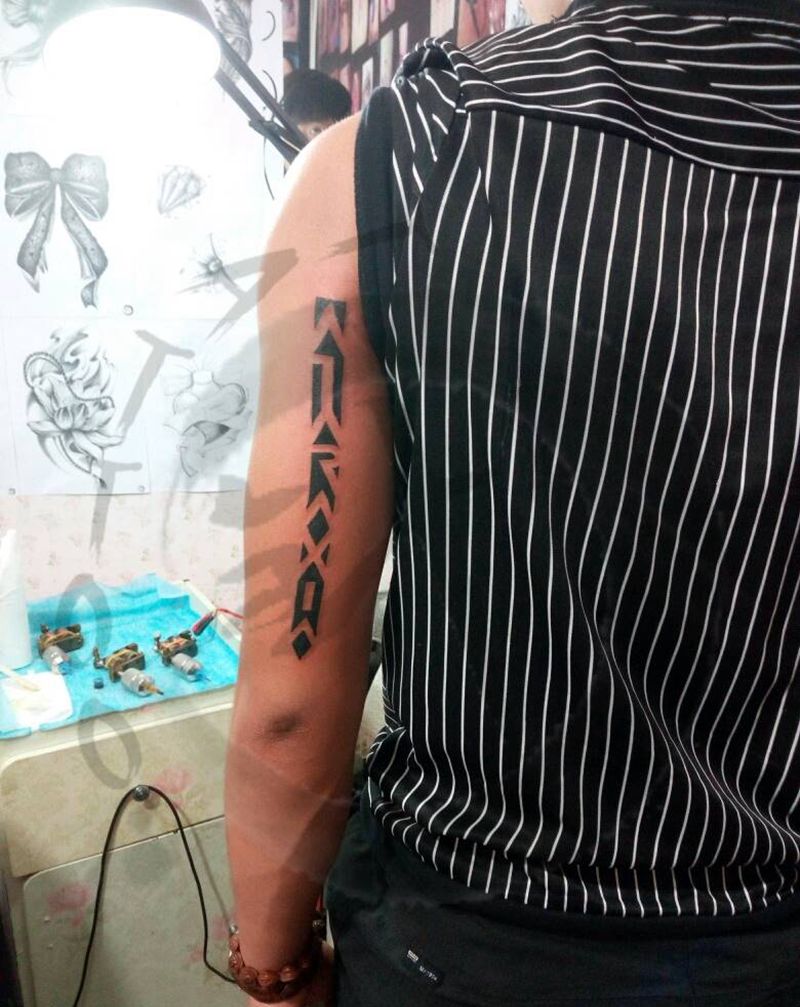 图腾纹身图片_手臂传统几何图腾小白刺青塔图~针成品纹身图案