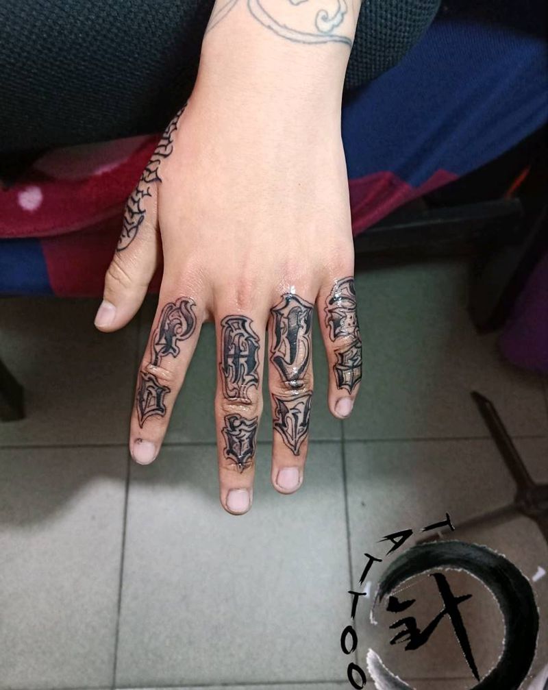 字母纹身图片_手部花体字纹身图案