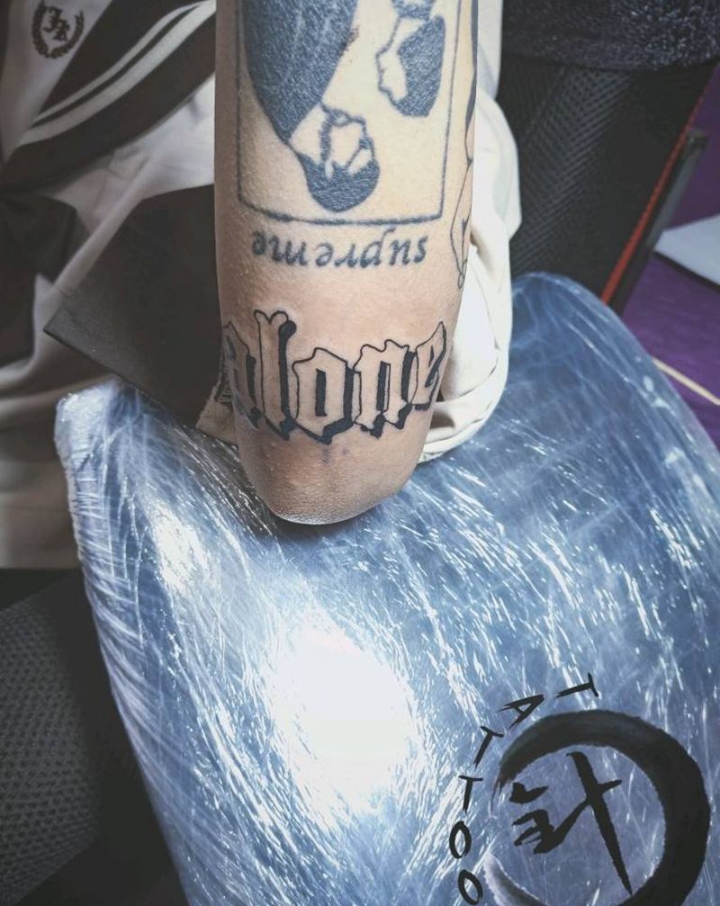 alone纹身图片_手臂花体字图腾字母纹身图案
