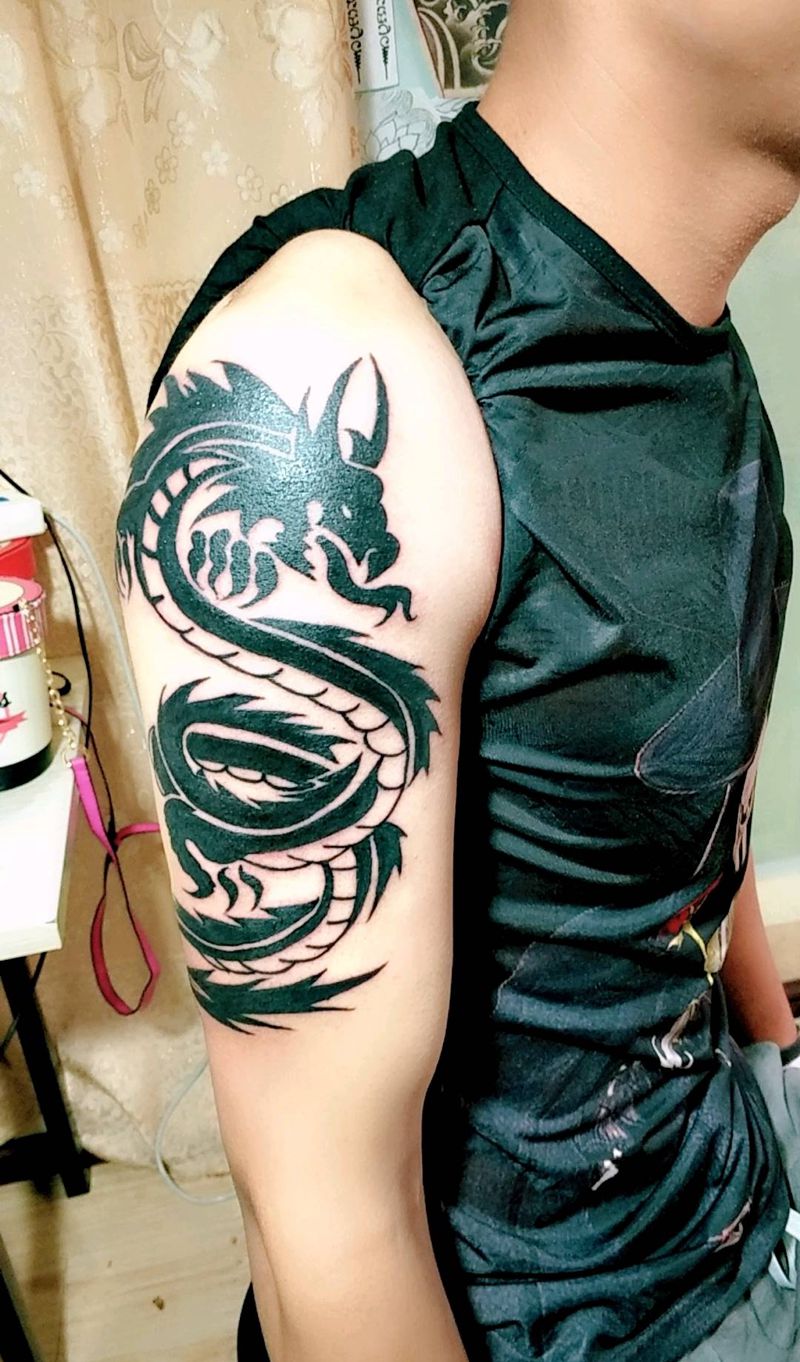 龙图腾纹身图片_手臂传统动物图腾原创成品纹身图案