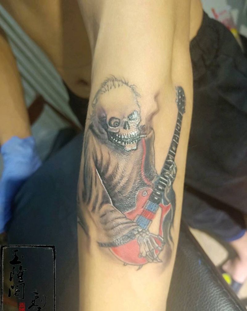 骷髅弹吉他纹身图片