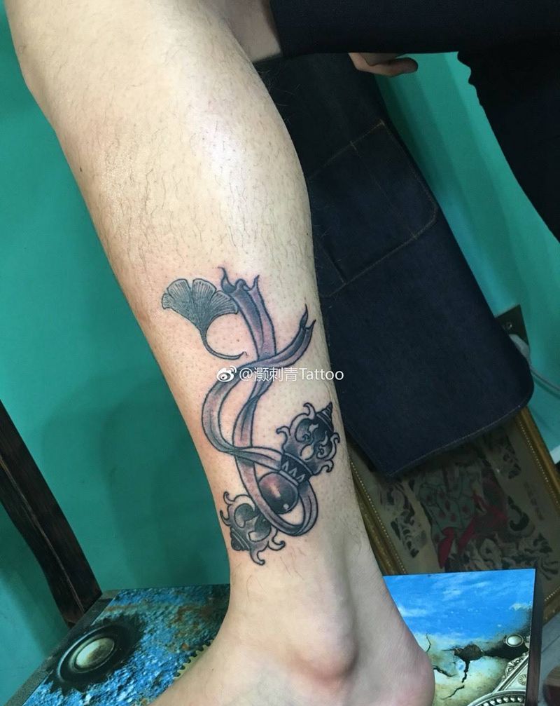 降魔杵·银杏叶遮盖纹身图片