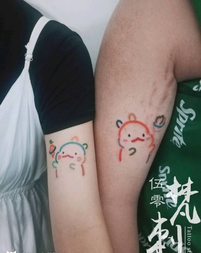 情侣卡通纹身纹身图片_手臂情侣卡通纹身图案