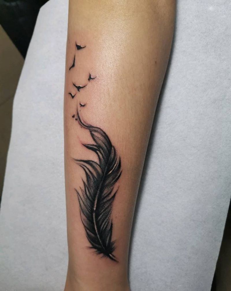羽毛盖疤纹身图片_手臂纹身图案