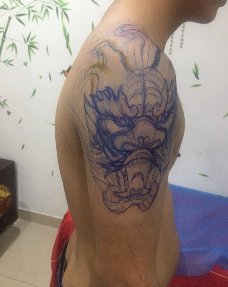 石碉龙头纹身图片