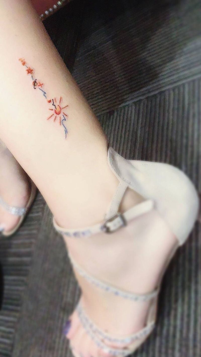 阳光海浪纹身图片_脚部纹身图案