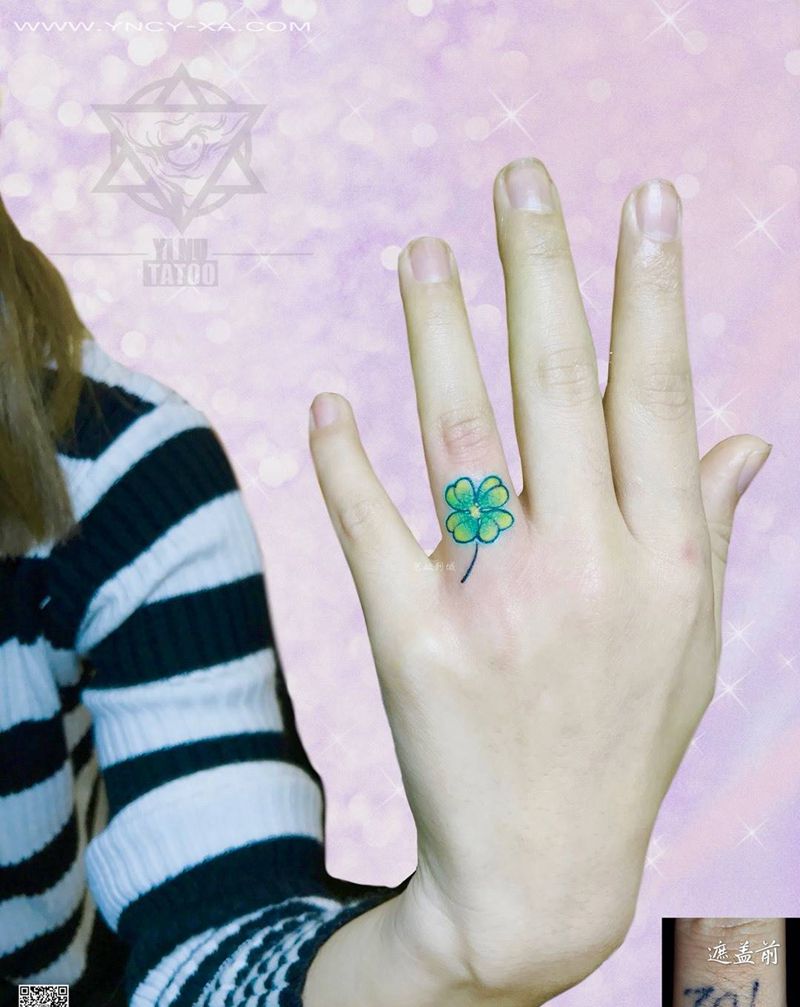 四叶草遮盖纹身图片_成品艺奴刺域植物清新手部纹身图案