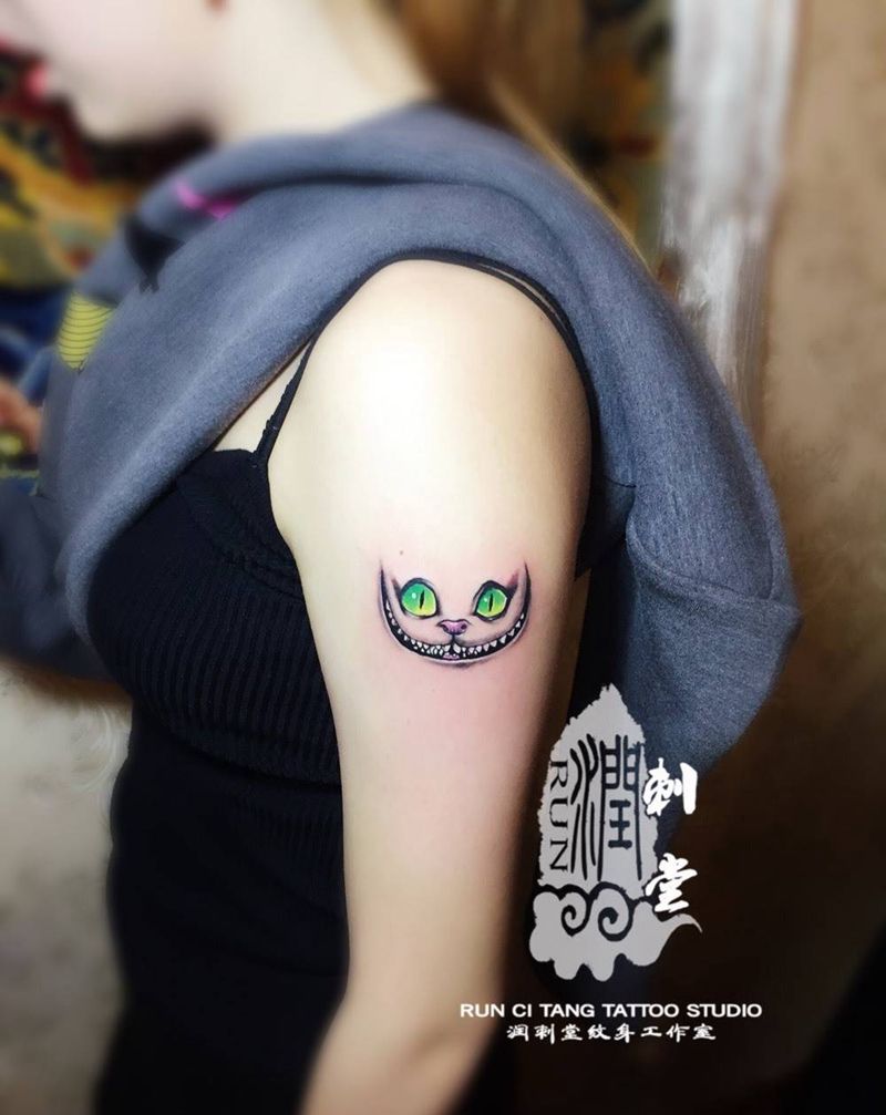 消失的柴郡猫纹身图片_插画手臂欧美清新动物纹身图案