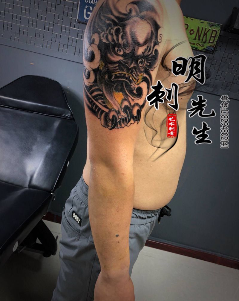 唐狮纹身图片_手臂新传统纹身图案