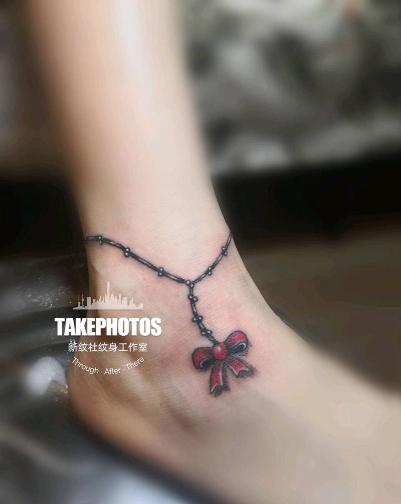 蝴蝶结脚链纹身图片_脚部腿部纹身图案