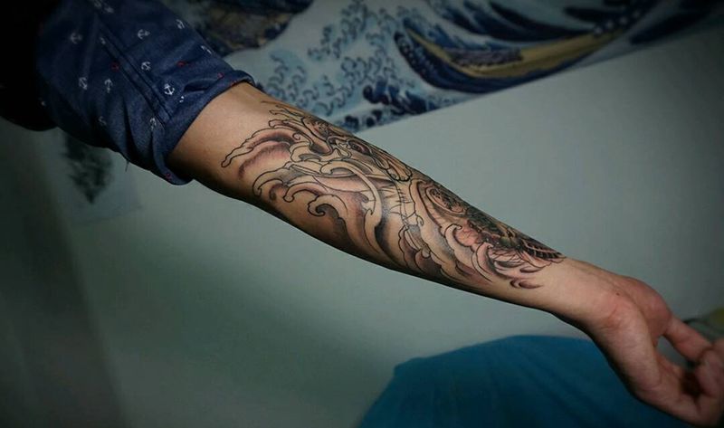 小臂鲤鱼纹身图片