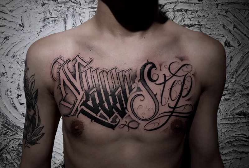 Never stop纹身图片_胸部花体字纹身图案