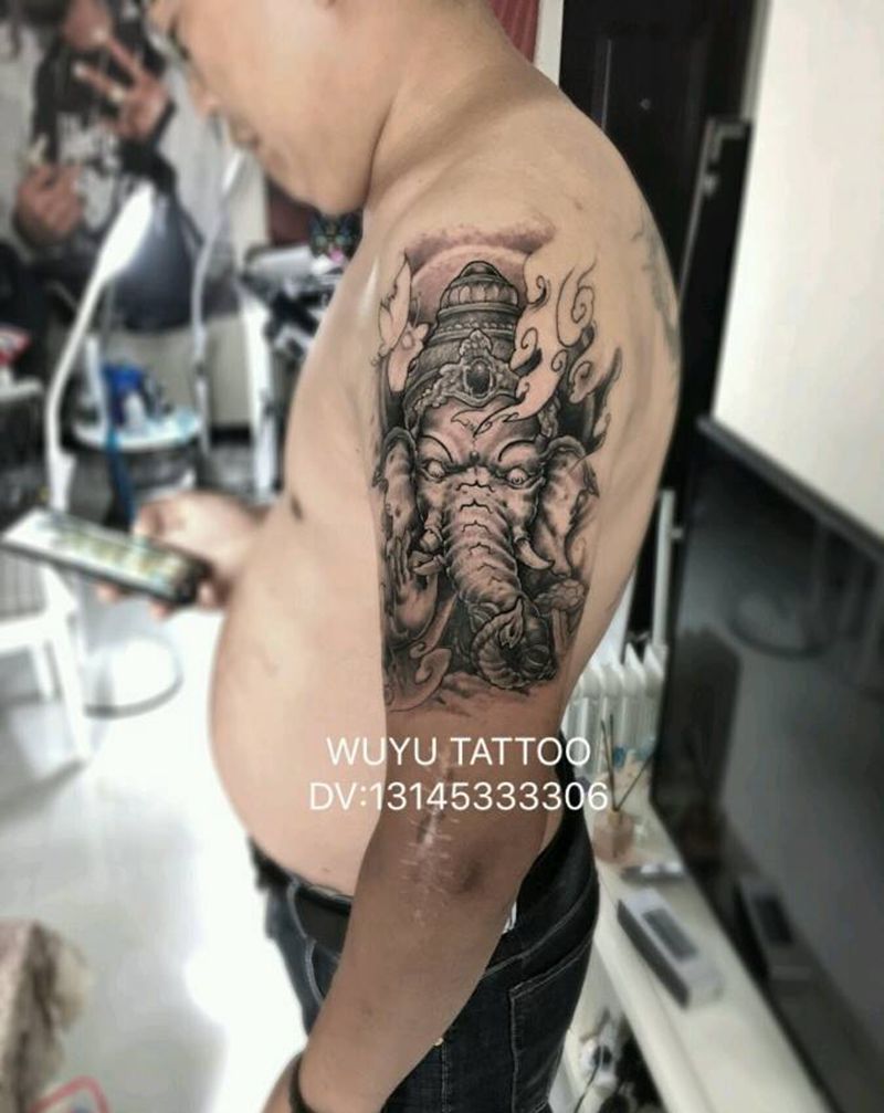 大臂象神纹身图片_手臂新传统纹身图案