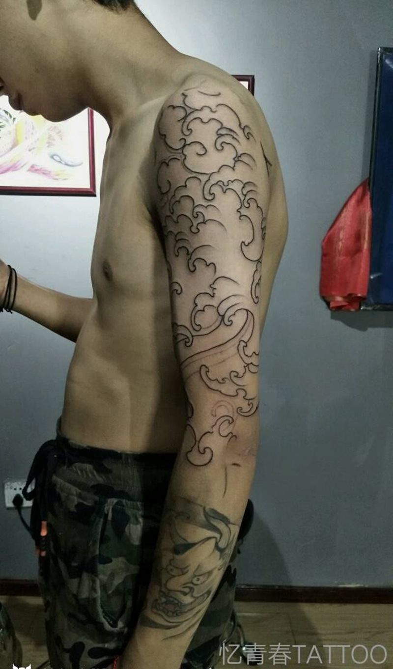 浪臂纹身图片_肩部手臂传统成品纹身图案
