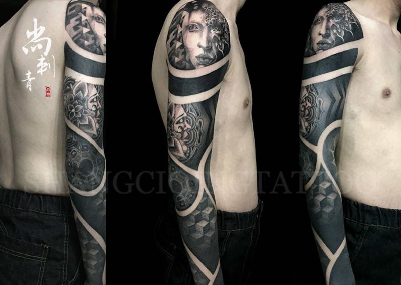 点刺黑臂纹身图片