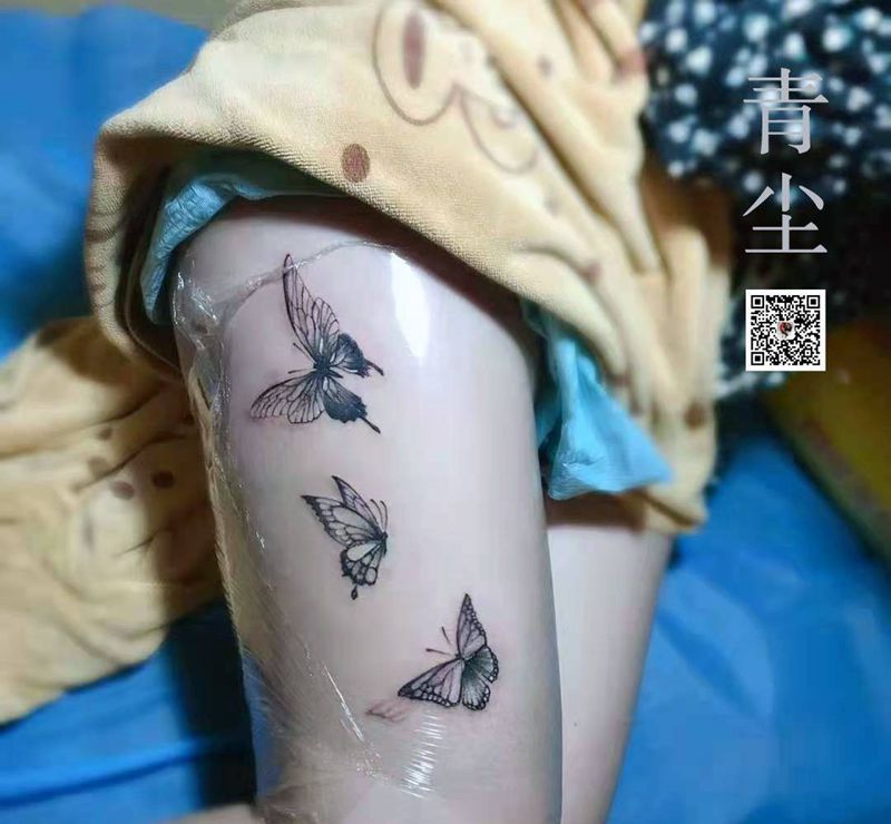 素蝶向林飞 红花逐风散纹身图片_腿部纹身图案