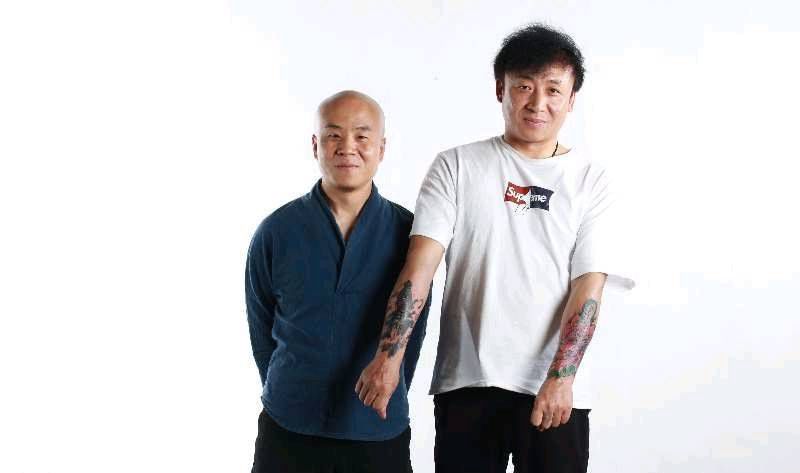 花蛇与降魔杵纹身图片_手臂纹身图案