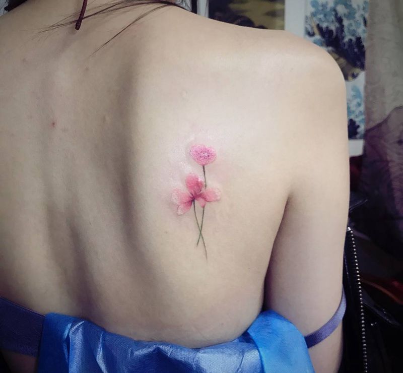 疤痕遮盖小花纹身图片