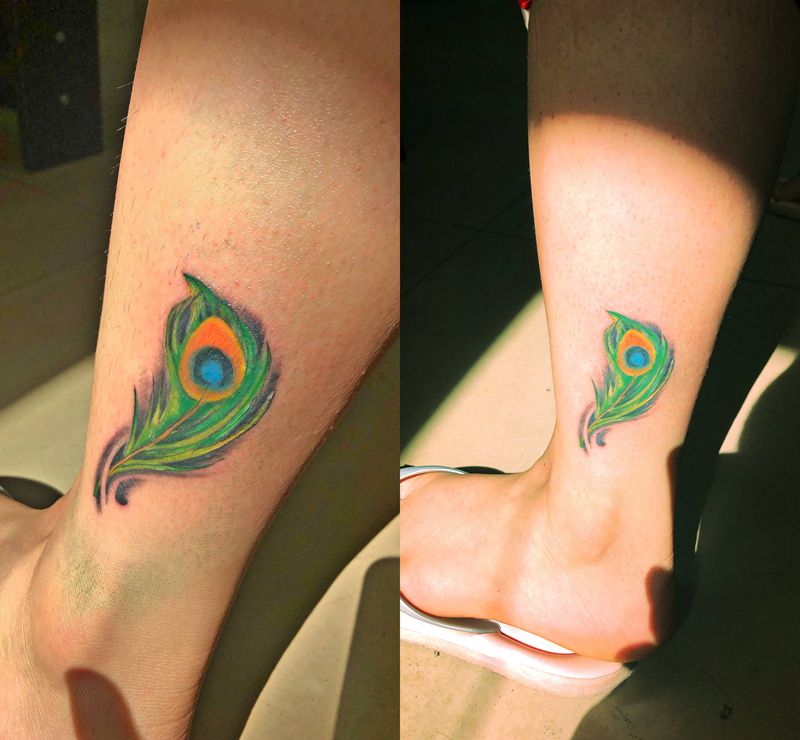孔雀羽毛纹身图片_腿部水彩纹身图案