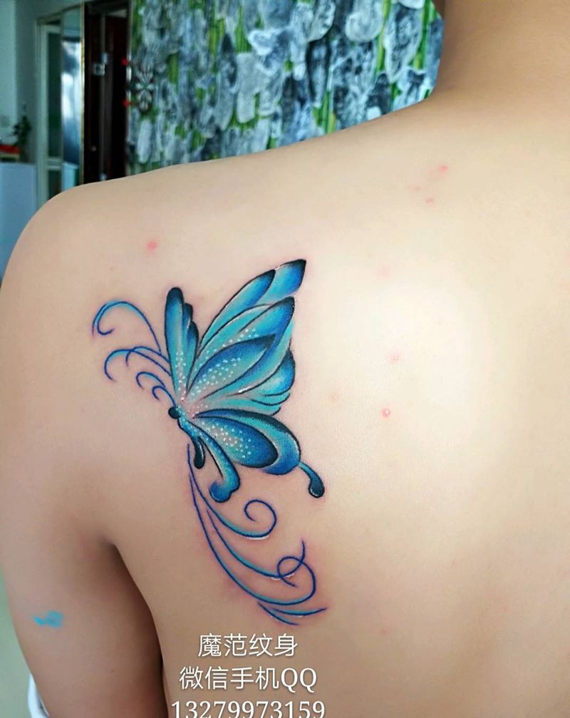 情侣蝴蝶纹身纹身图片_背部动物情侣蝴蝶成品纹身图案