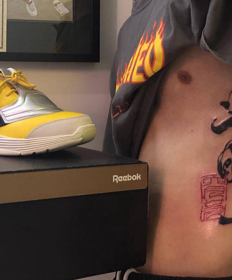 光明纹身图片_腰部纹身图案