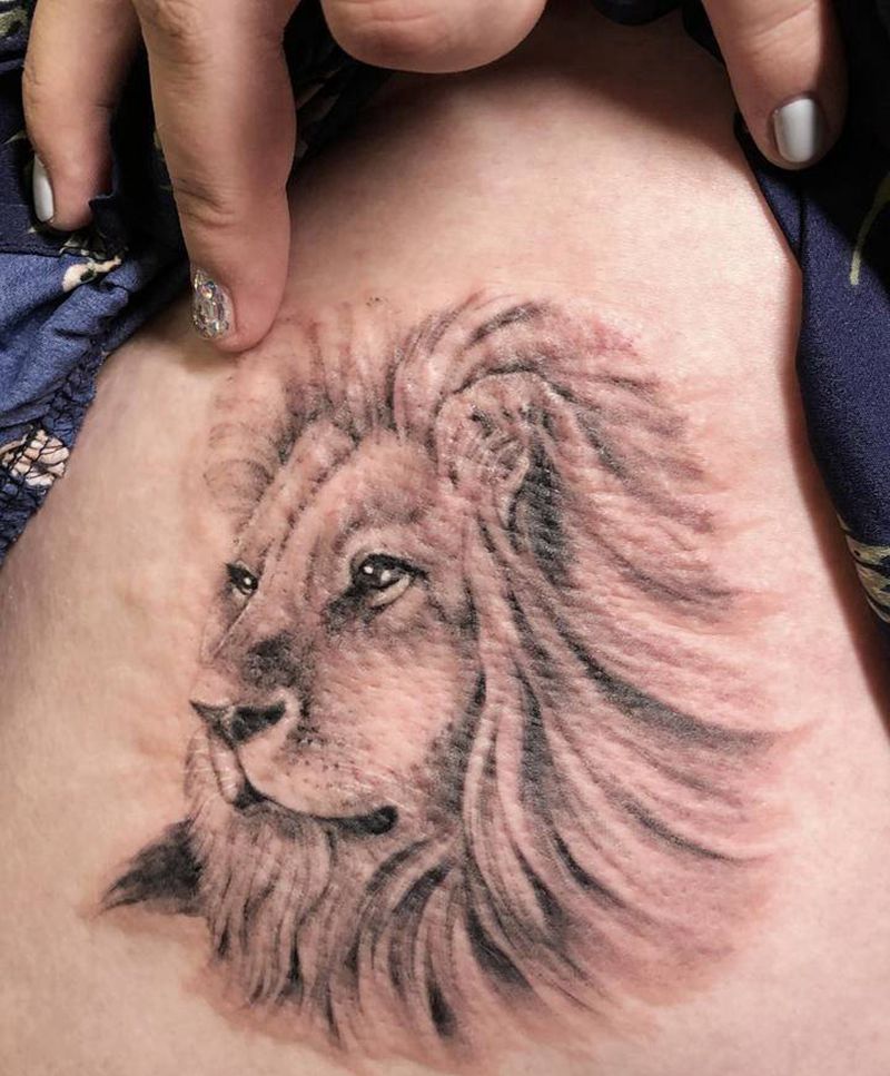 狮子纹身图片_腿部欧美写实纹身图案