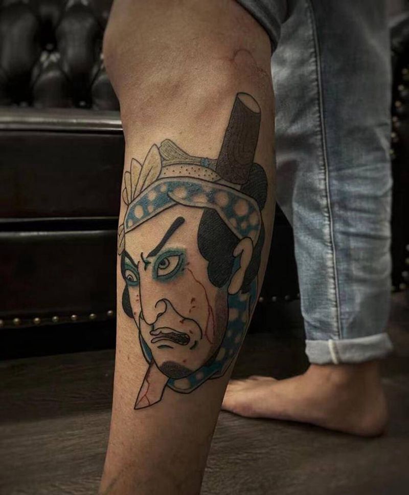 生首纹身图片_腿部老传统纹身图案