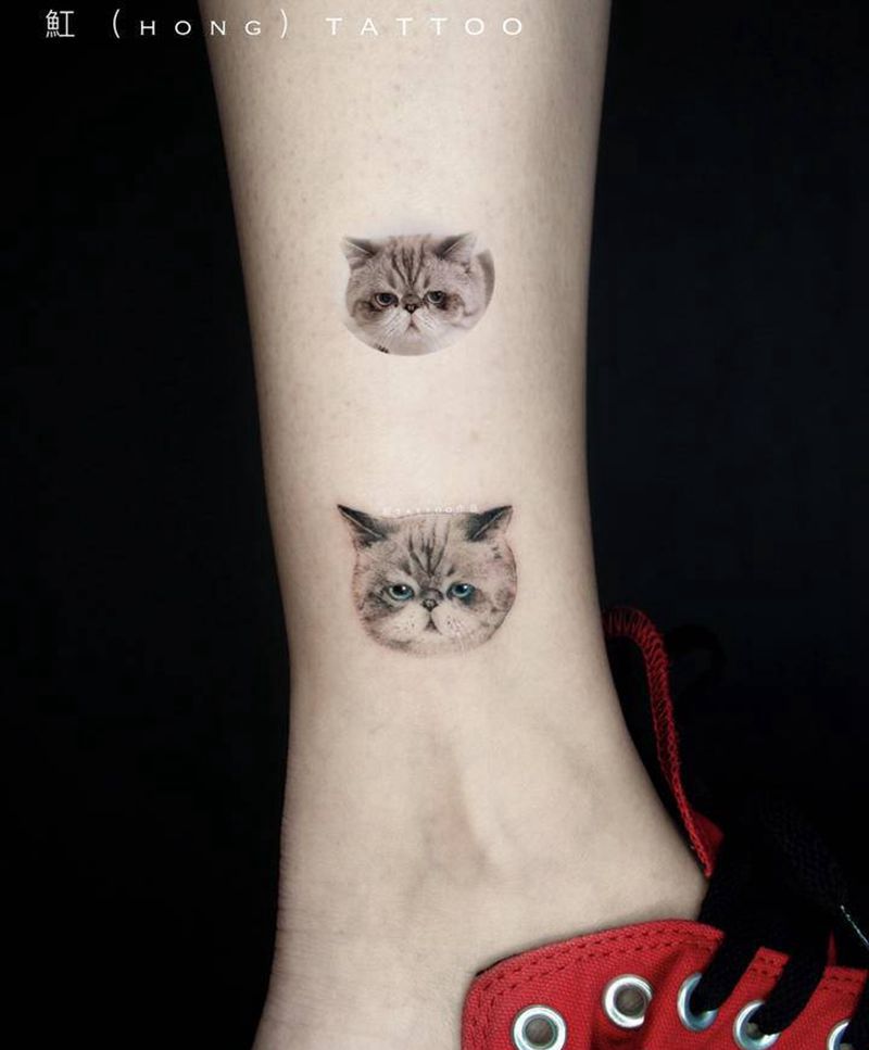 加菲猫纹身图片_腿部脚部欧美写实点刺猫加菲猫宠物纹身图案