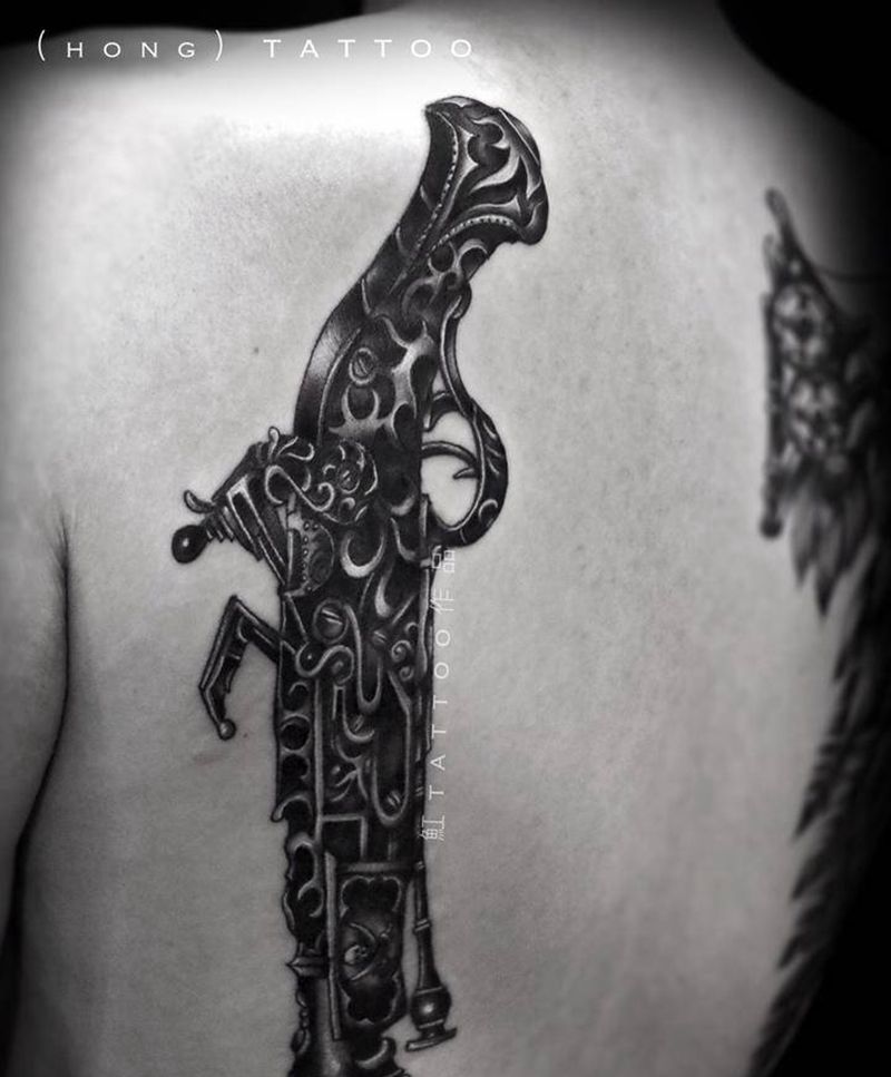 火枪纹身图片_背部手臂欧美写实火枪枪纹身图案