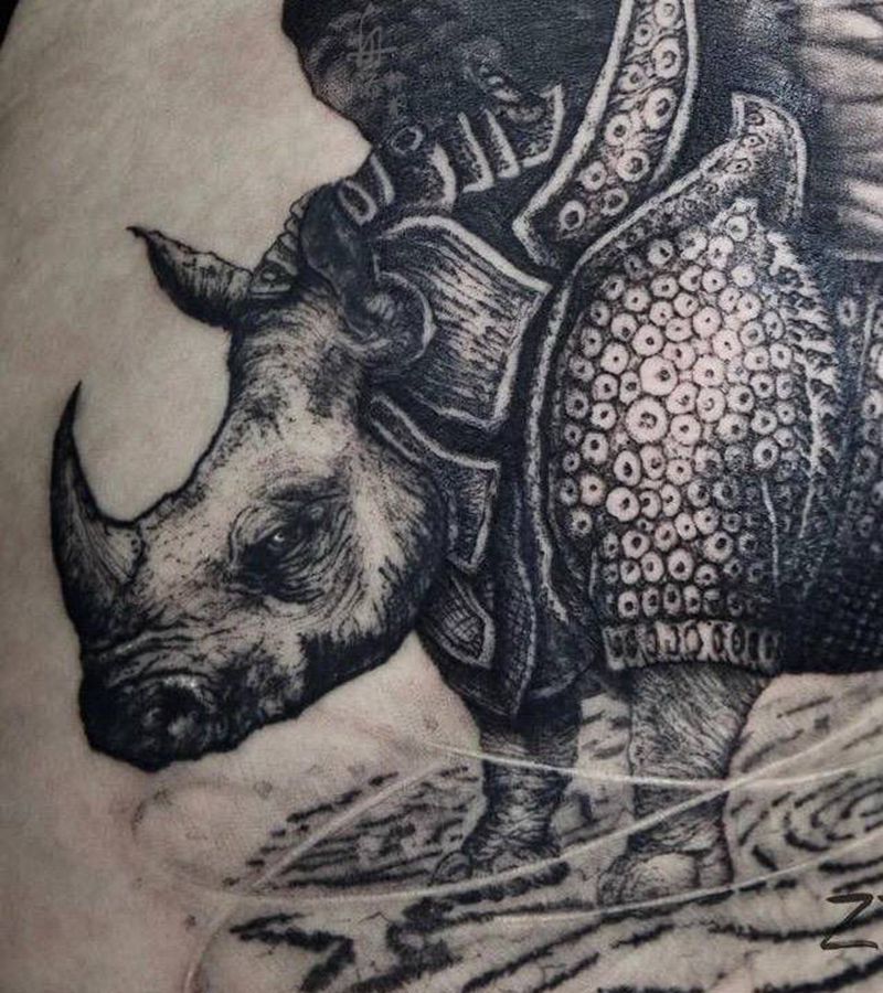 恋爱的犀牛纹身图片_腿部欧美写实点刺犀牛翅膀纹身图案