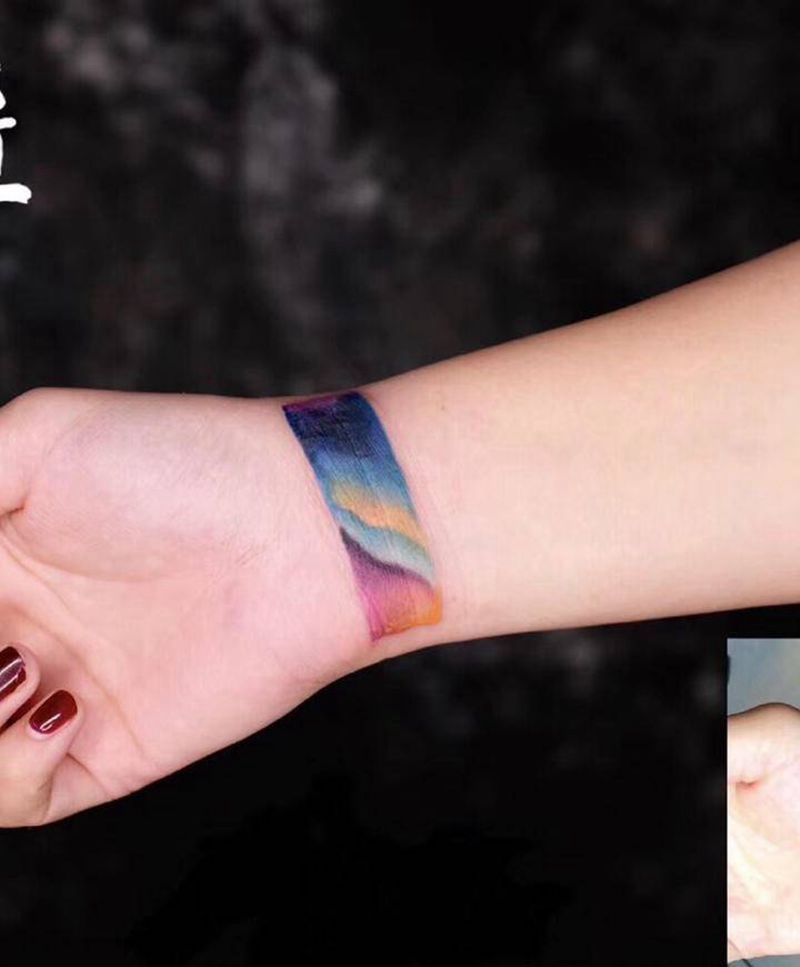 丝带纹身图片_手臂水墨覆盖纹身图案