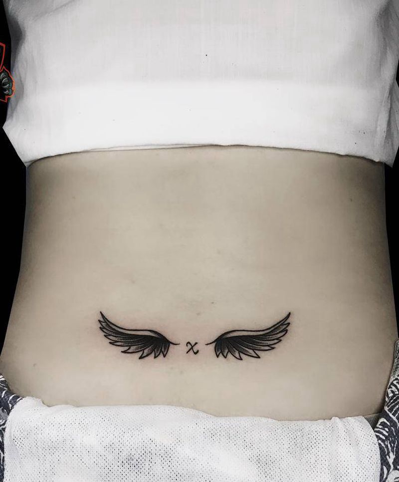 翅膀纹身图片_腰部图腾翅膀纹身纹身图案