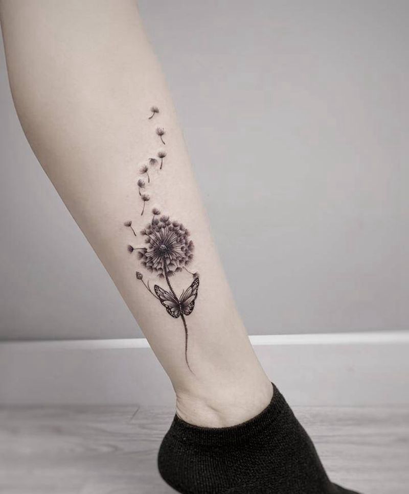 蒲公英飞舞纹身图片_脚部腿部欧美写实点刺花纹身蒲公英小腿花纹身图案